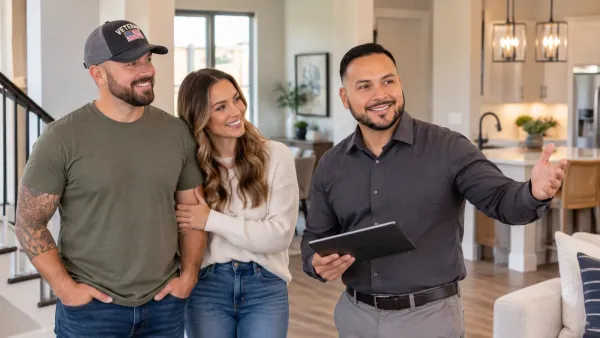 Veteran homebuyer receiving keys to a new home in the Houston area