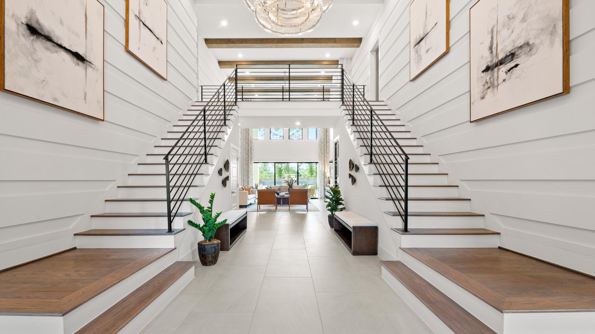 Two-story entry with dual staircases in a new construction home for sale in Fort Bend County